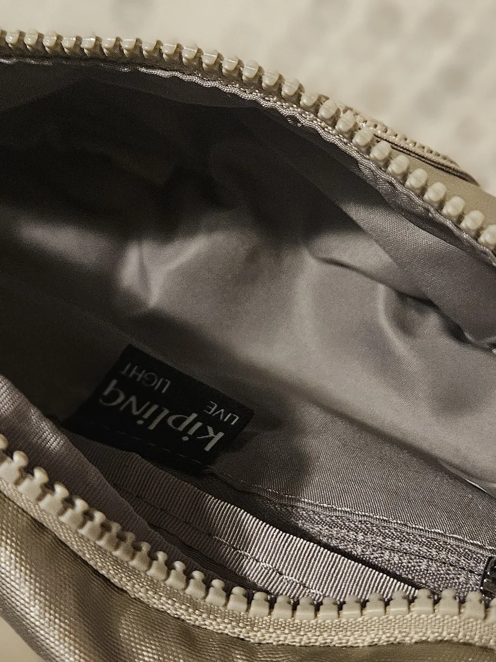Kipling Metallic Champagne Crossbody Belt Bag With Monkey Chain. Fall, Trendy